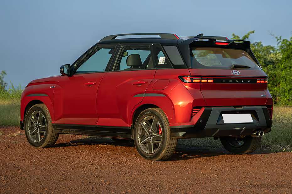 Hyundai Venue N Line rear left three quarter view showing dual exhaust styling and sporty rear bumper Hyundai Venue N Line rear left three quarter view showing dual exhaust styling and sporty rear bumper