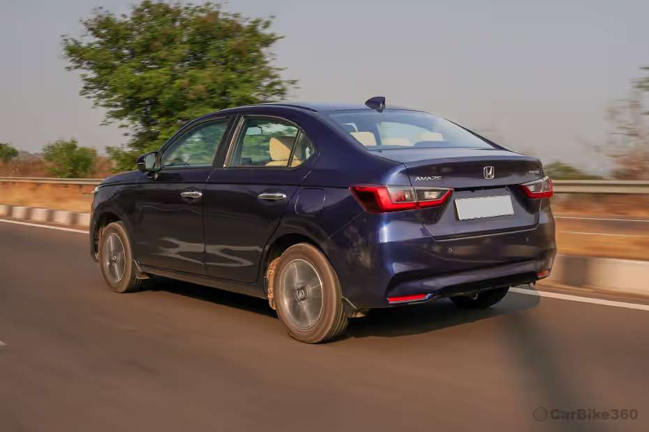 Honda Amaze Driving: Rear Left Three Quarter View Honda Amaze Driving: Rear Left Three Quarter View
