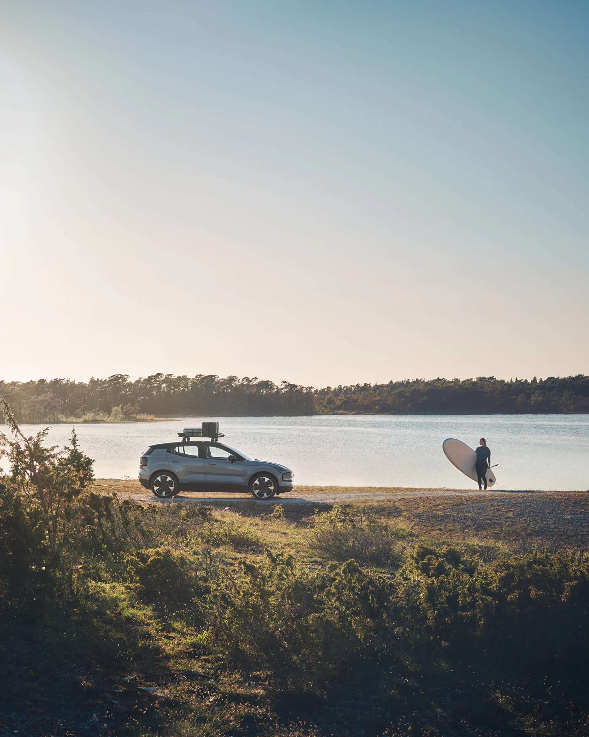 2026 Volvo EX30 Twin Motor Performance on a scenic highway, showcasing its 592 km city/475 km combined electric range capability.