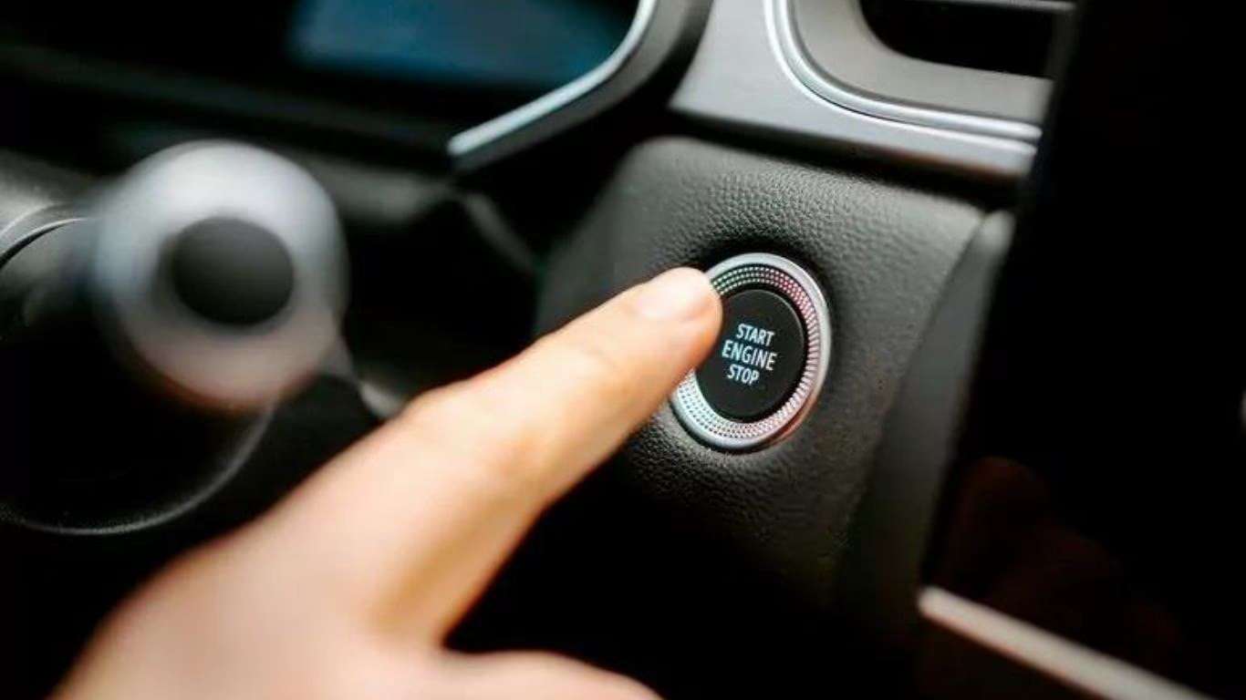 Close-up of the gearbox console with illuminated START/STOP button right next to the gear leve