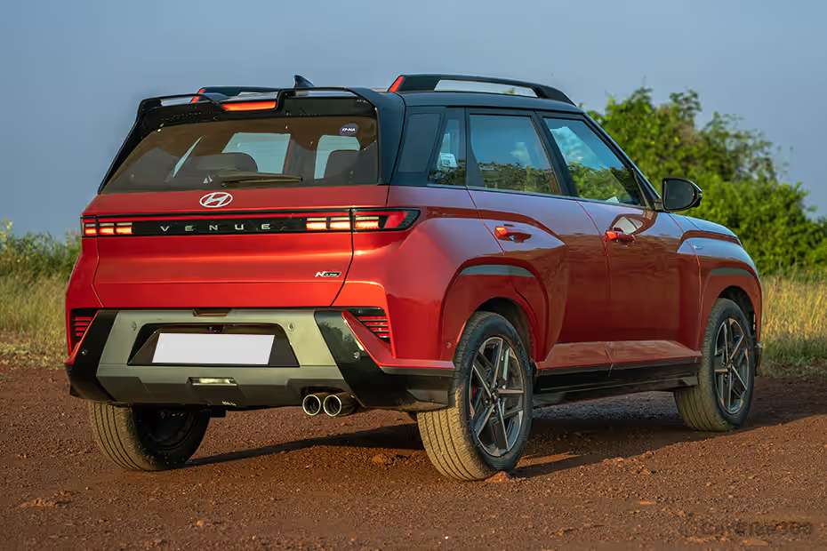 Hyundai Venue N Line rear right three quarter angle highlighting rear profile, exhaust and body lines Hyundai Venue N Line rear right three quarter angle highlighting rear profile, exhaust and body lines