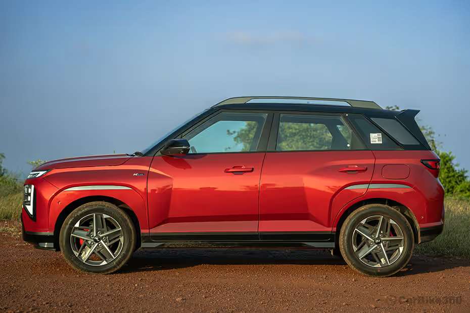 Hyundai Venue N Line left side profile view showing sharp body lines, alloy wheels and compact SUV stance Hyundai Venue N Line left side profile view showing sharp body lines, alloy wheels and compact SUV stance